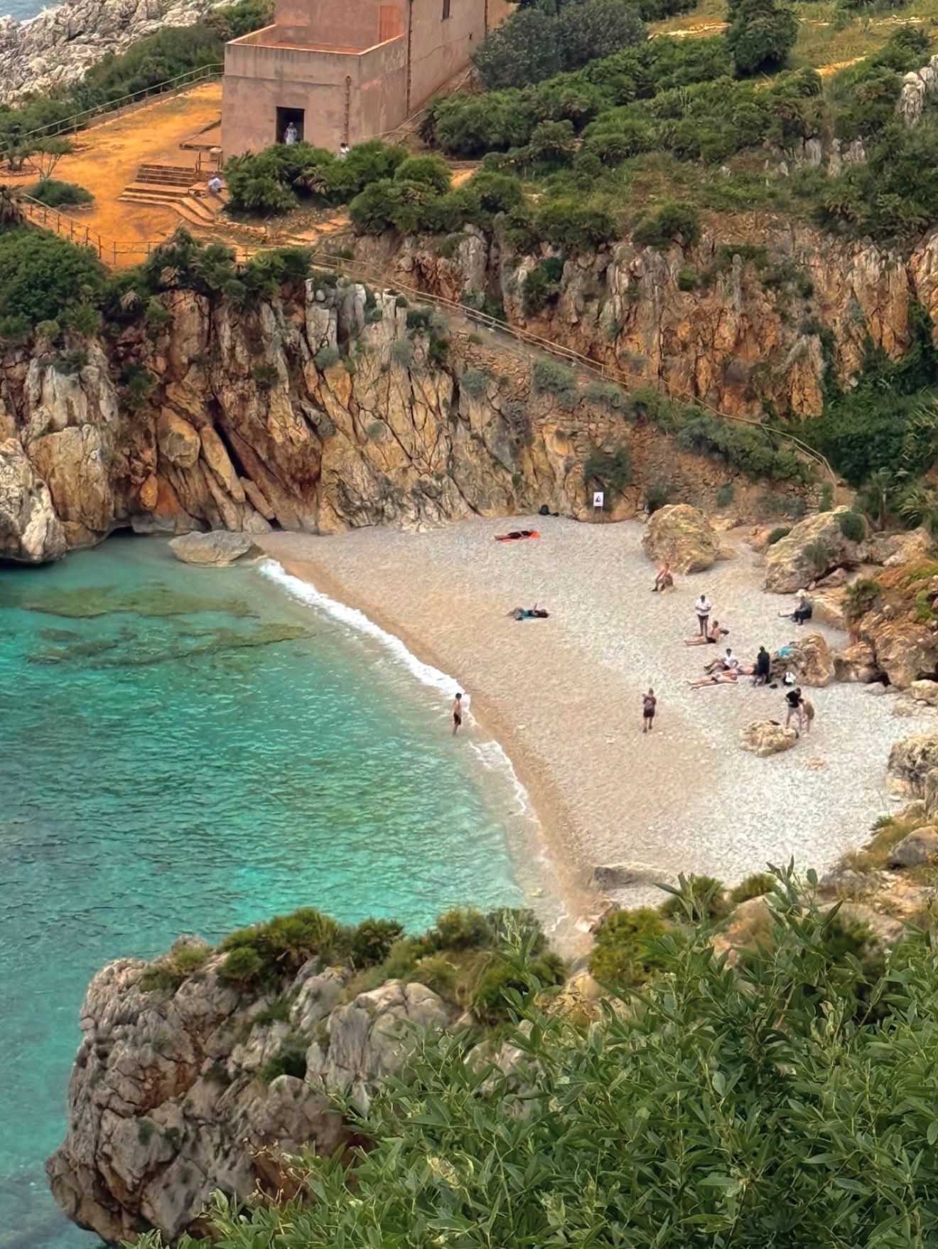 Sicilian rocky cove with hidden lagoon